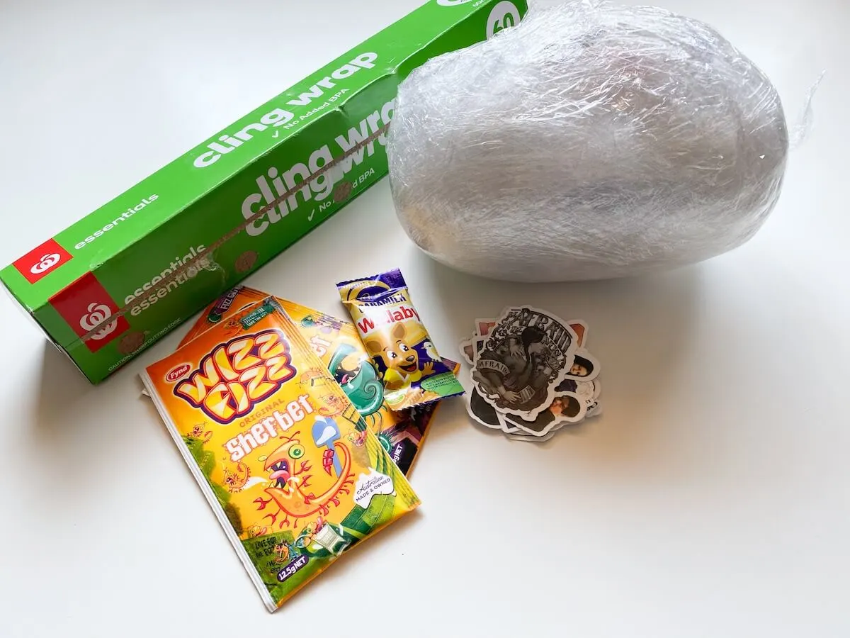 Saran Wrap Candy Ball Game for Holiday School Parties - Arts and Bricks