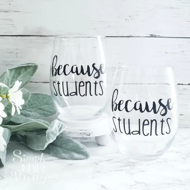 Funny teachers gift glasses with 'because students' in black vinyl.