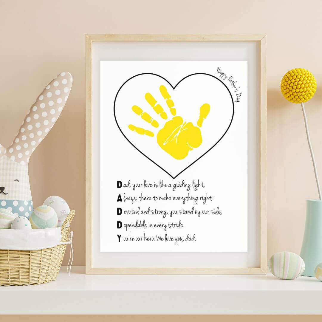 framed father's day handprint art printable in wooden frame on a shelf in a child's bedroom next to a stuffed bunny.