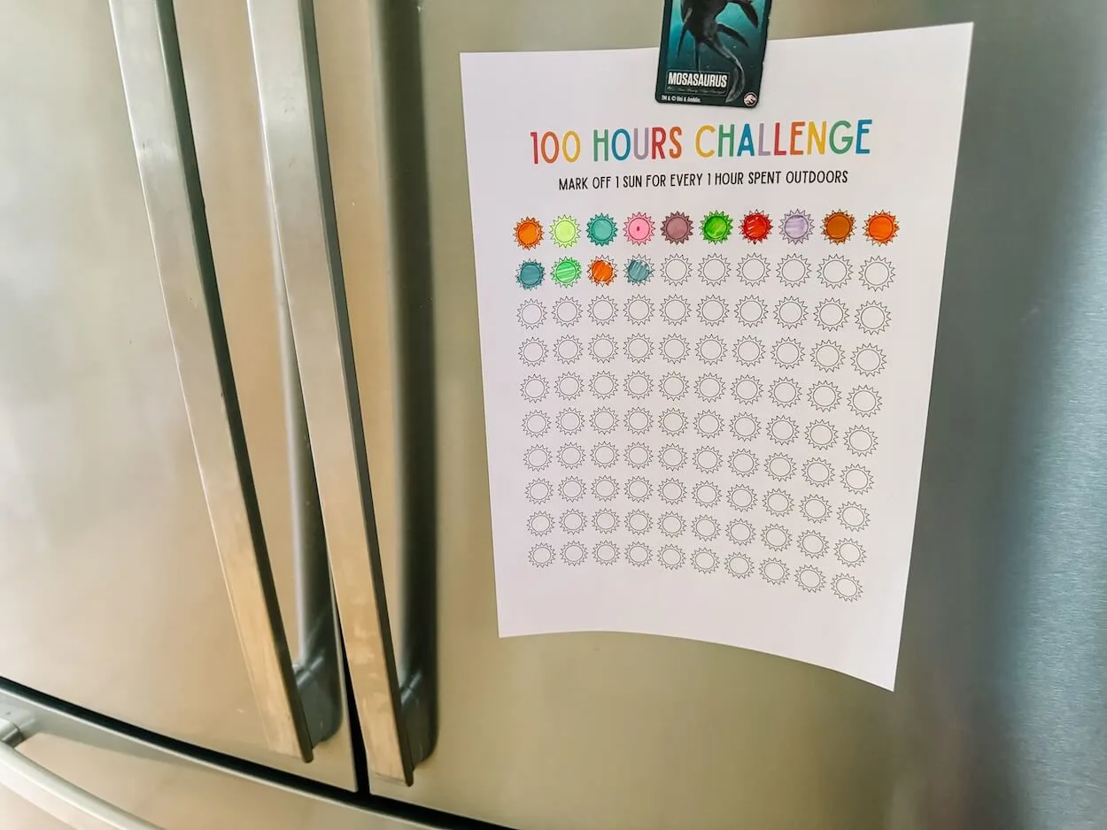 100 hours outside challenge on fridge with magnet.